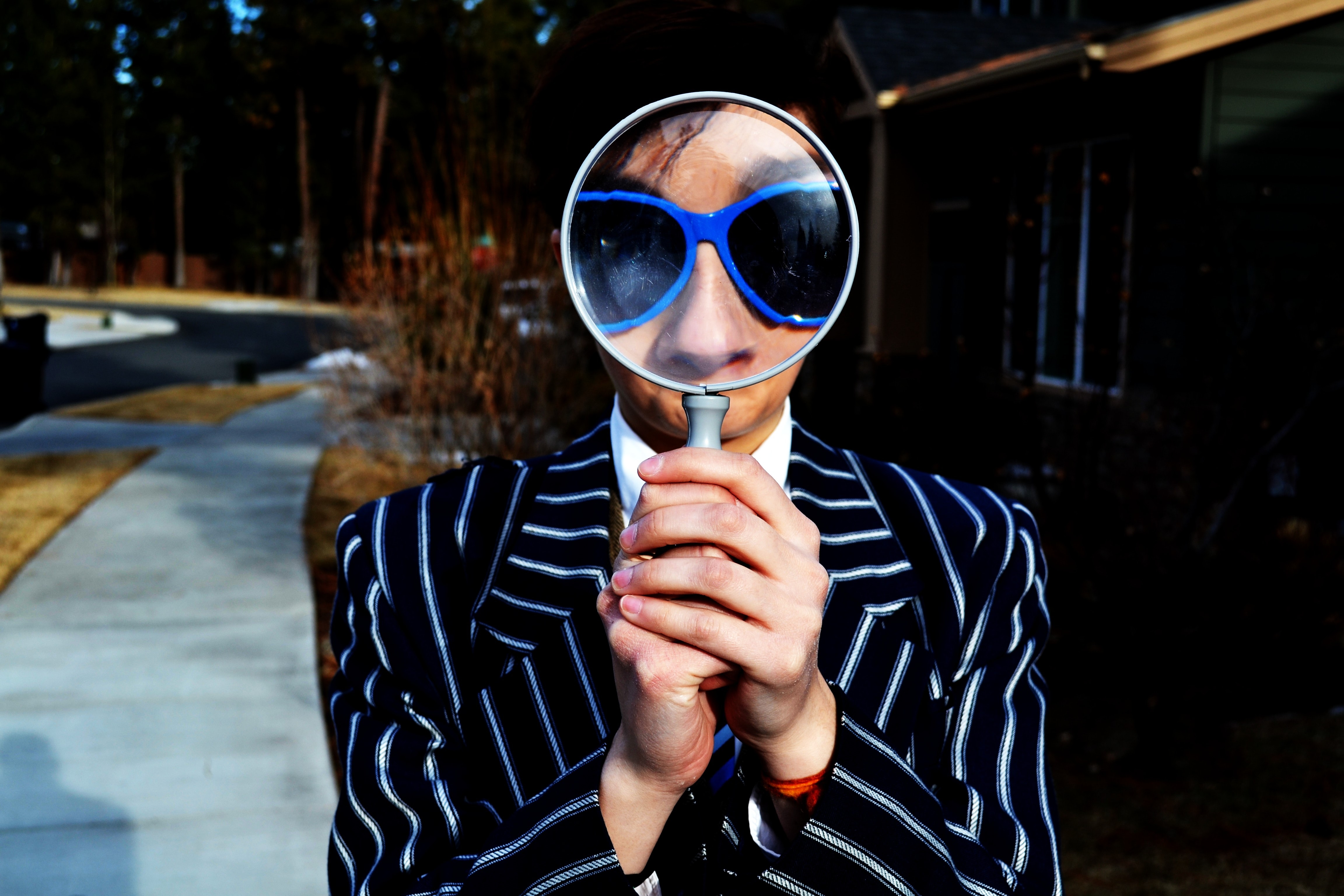 Woman searching with magnifying glass