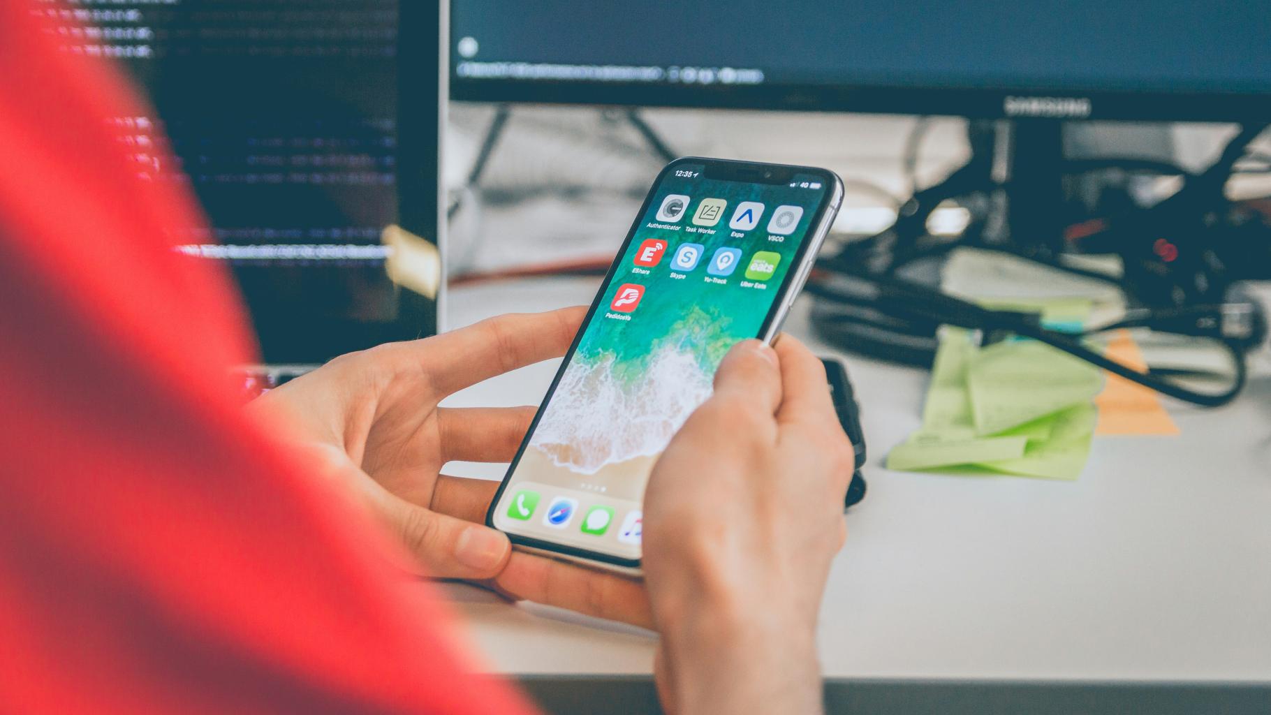 User using Cell Phone at Work