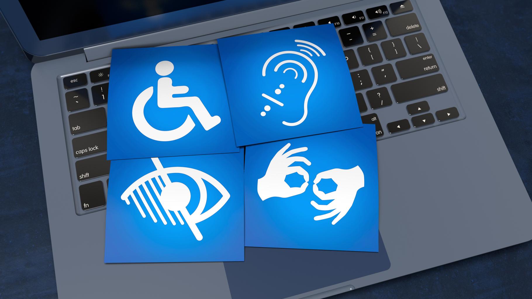 4 disability icons laid out in a grid and placed on a laptop