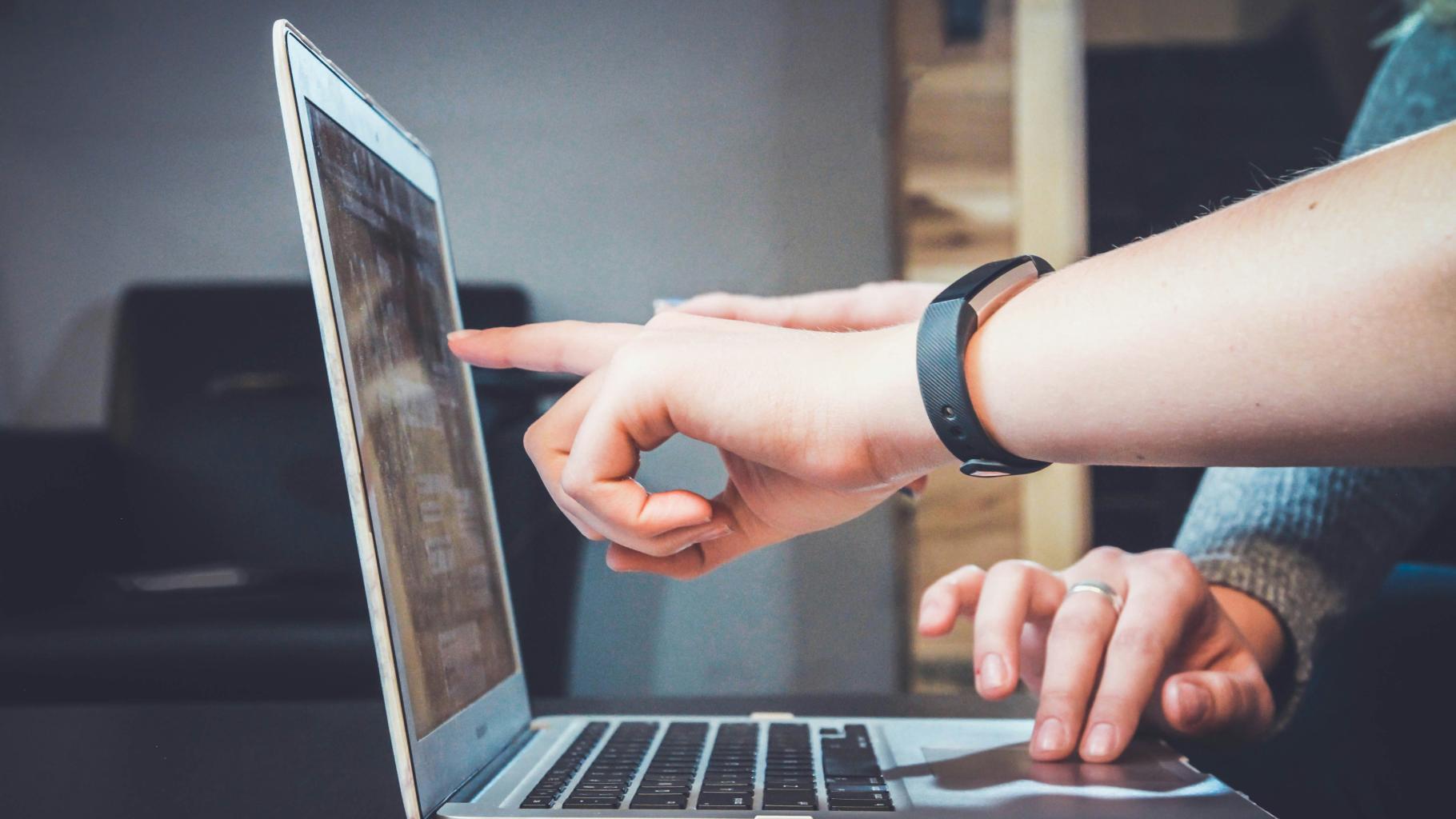 People working on computer together