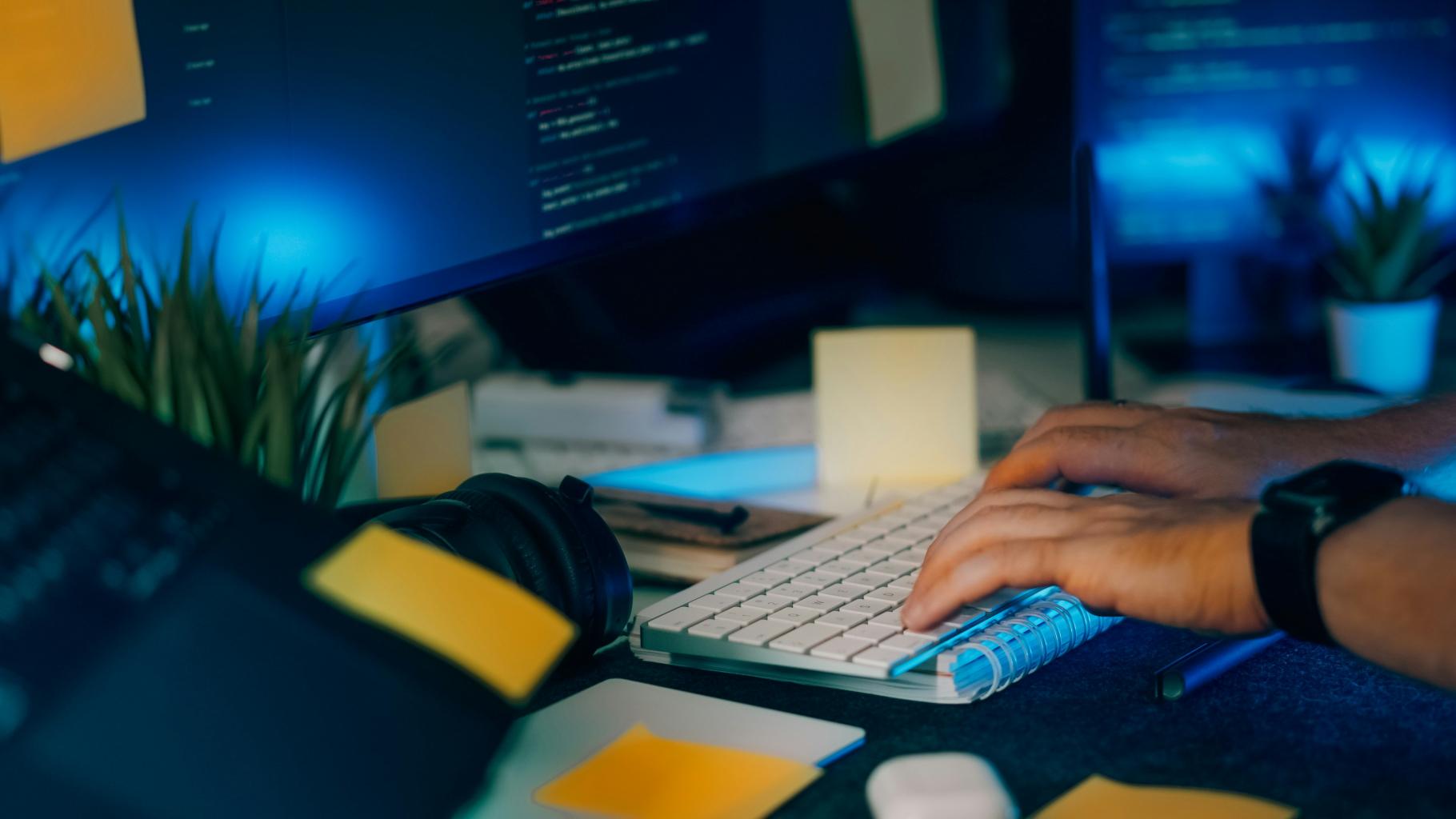 Person typing at a computer